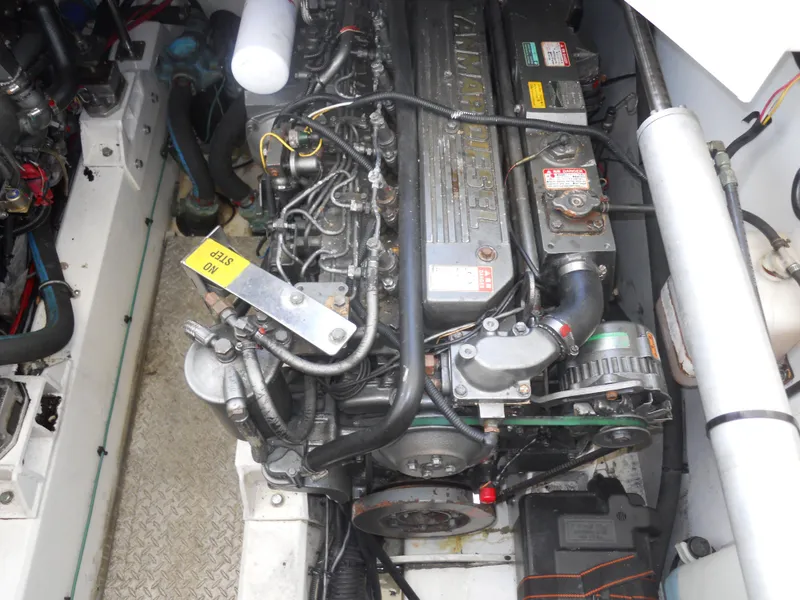 Slide: The Image of Engine compartment of a 2000 Boston Whaler 34 Defiance boat, showcasing detailed machinery. - 23