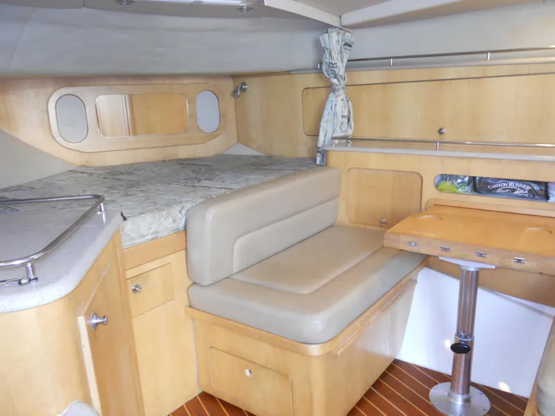 Slide: The Image of Interior of 2000 Boston Whaler 34 Defiance boat with seating and table. - 30