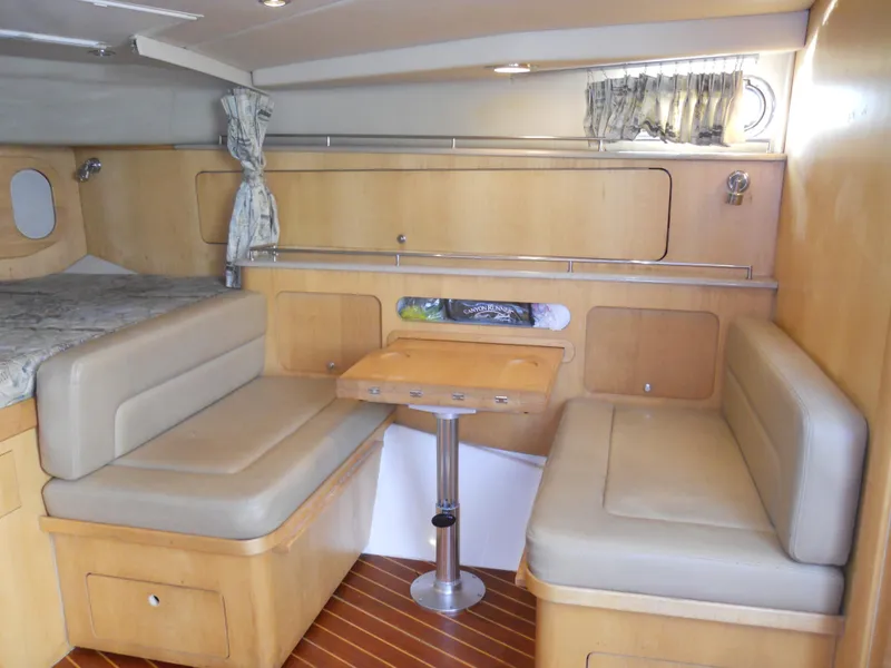 Slide: The Image of Interior of 2000 Boston Whaler 34 Defiance with seating and table. - 31