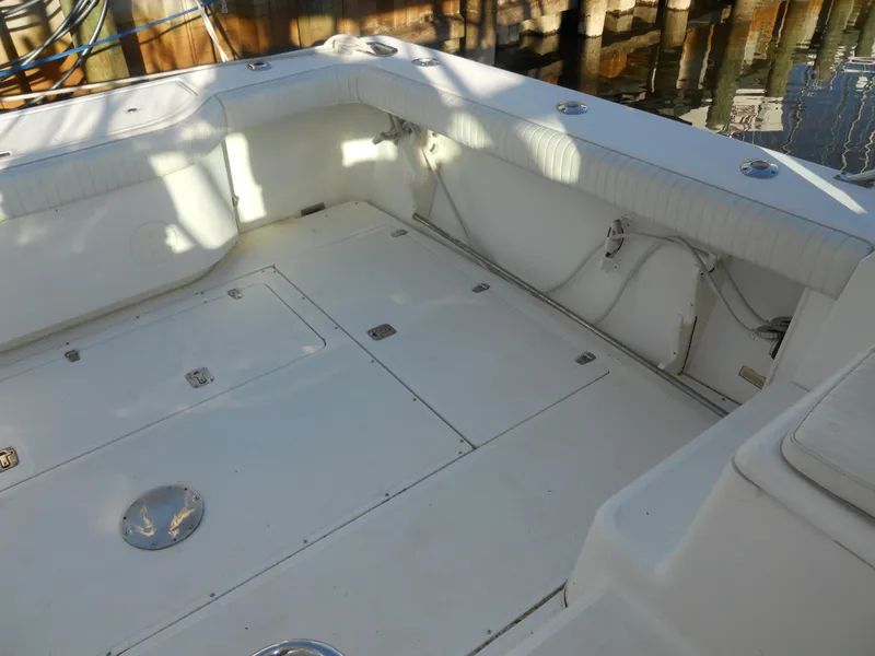 Slide: The Image of Spacious deck of 2000 Boston Whaler 34 Defiance boat, featuring storage compartments. - 9