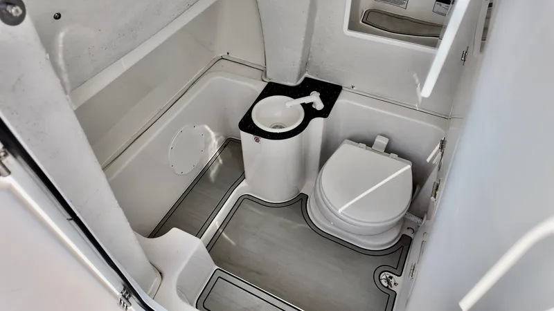 Slide: The Image of 2023 Sea Fox 268 Commander boat bathroom with toilet and sink. - 10