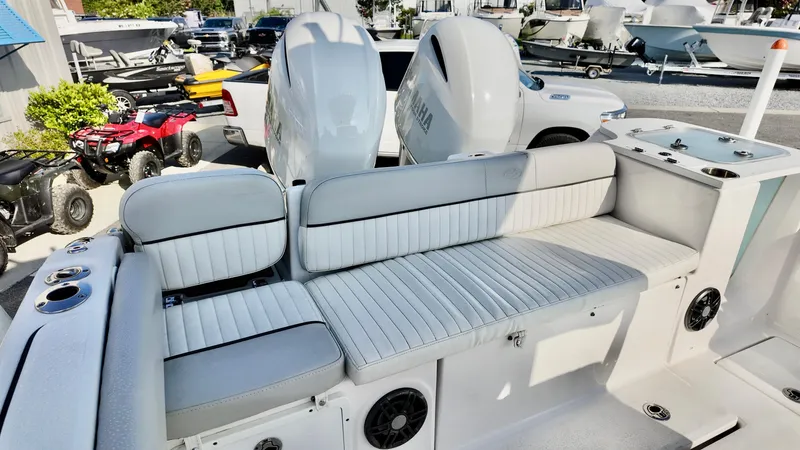 Slide: The Image of 2023 Sea Fox 268 Commander boat interior with white cushioned seating and Yamaha engines. - 11