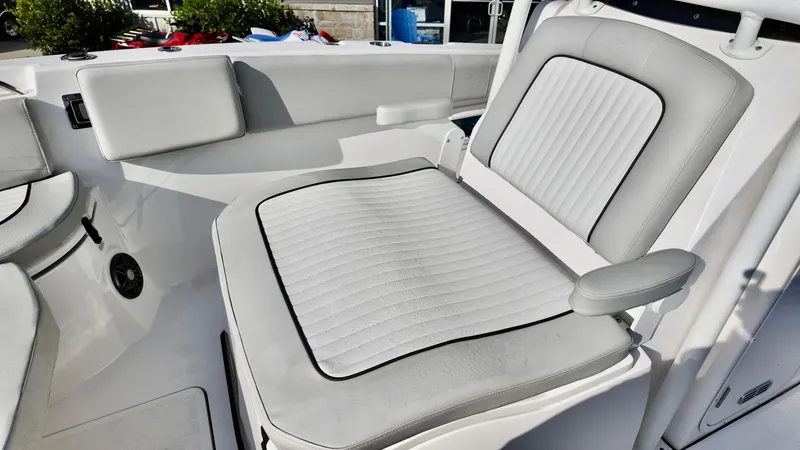 Slide: The Image of 2023 Sea Fox 268 Commander boat seat with white and gray upholstery. - 15