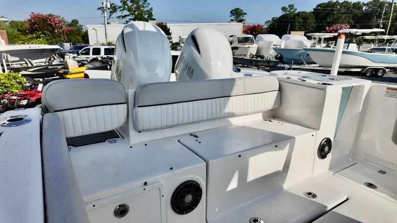 Slide: The Image of 2023 Sea Fox 268 Commander boat with dual Yamaha engines, featuring a spacious deck layout. - 23