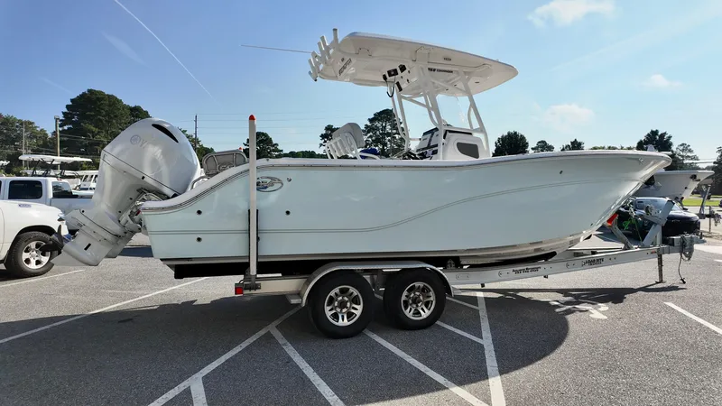 Slide: The Image of 2023 Sea Fox 268 Commander boat on trailer in parking lot, side view. - 5