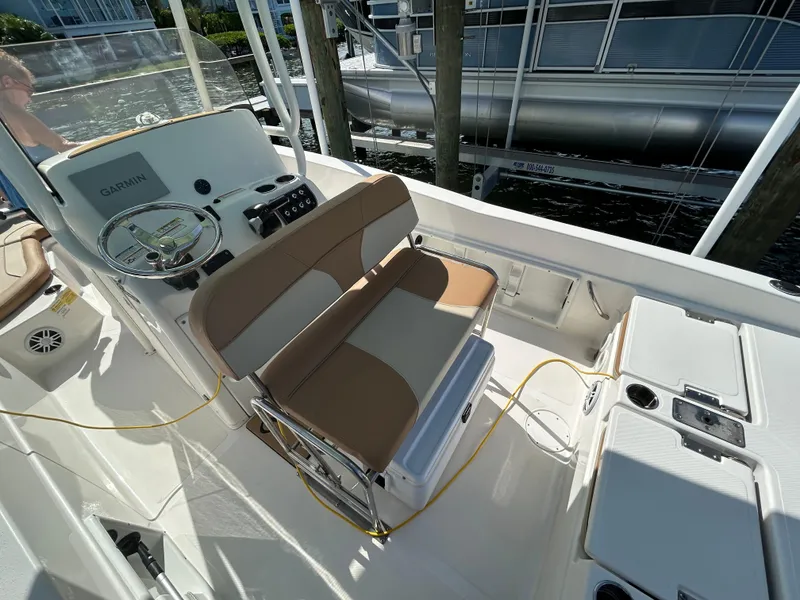 Slide: The Image of Lenco trim tab control panel on 2023 NauticStar 231 Hybrid boat. - 11