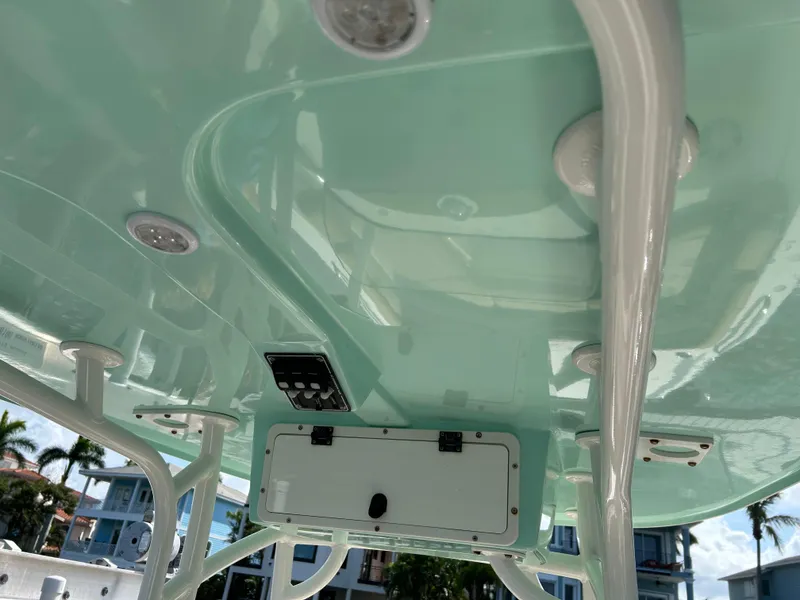 Slide: The Image of Control panel and blue LED light on 2023 NauticStar 231 Hybrid boat. - 20