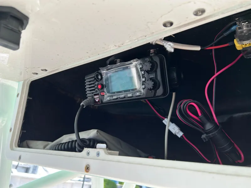 Slide: The Image of 2023 NauticStar 231 Hybrid boat interior with steering wheel and seating. - 22