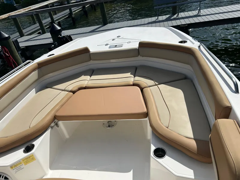 Slide: The Image of 2023 NauticStar 231 Hybrid boat interior with tan seating and spacious layout. - 27