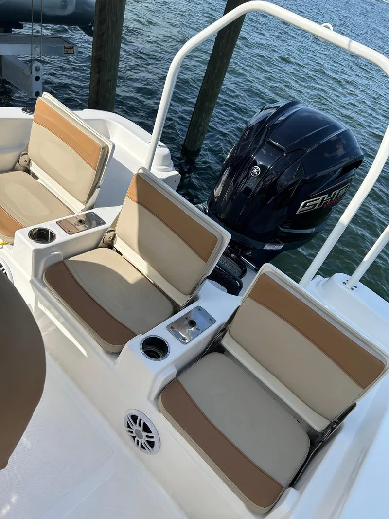 Slide: The Image of 2023 NauticStar 231 Hybrid boat seat with open storage compartment. - 38