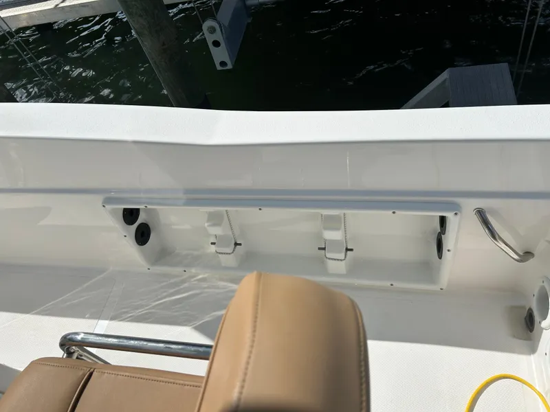 Slide: The Image of 2023 NauticStar 231 Hybrid boat interior with tan seating and white deck. - 40
