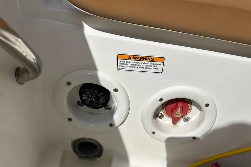 Slide: The Image of Battery compartment of 2023 NauticStar 231 Hybrid boat with wiring and connections. - 43