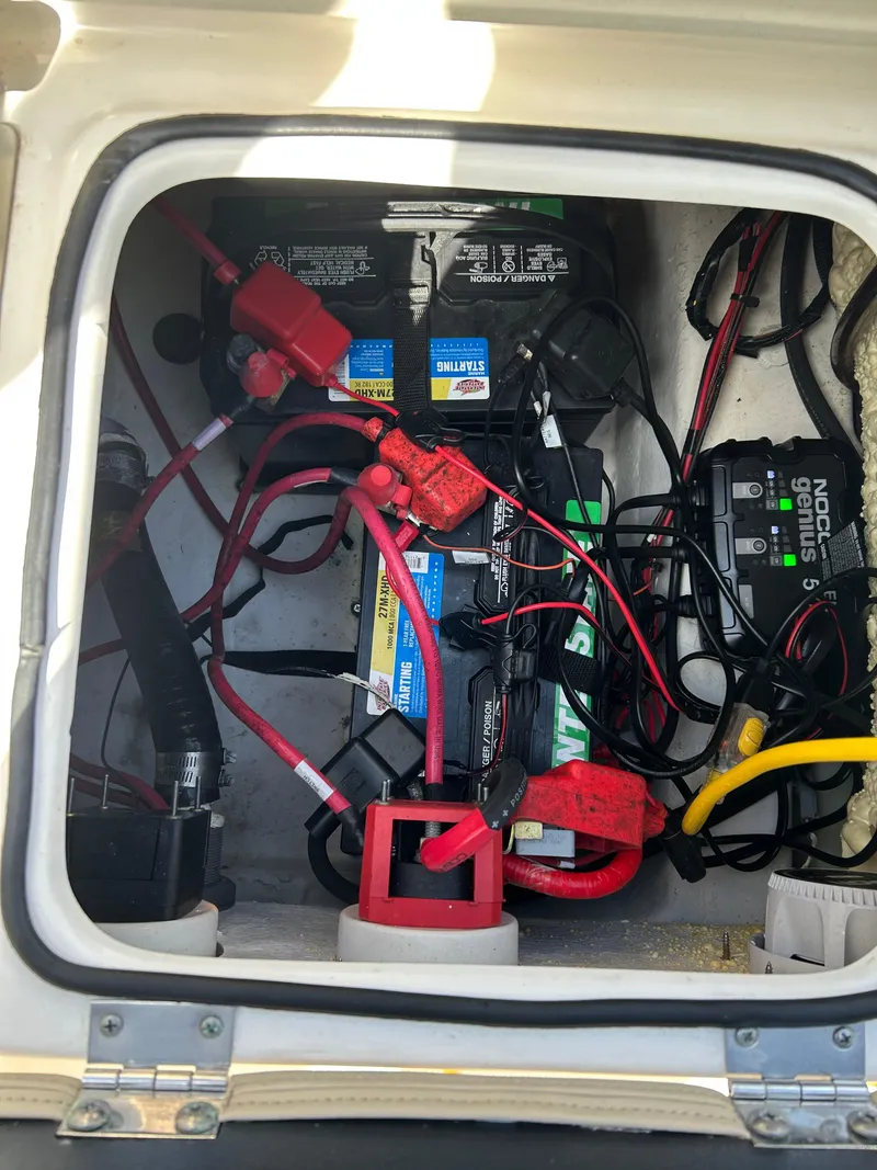 Slide: The Image of Interior wiring and battery setup of 2023 NauticStar 231 Hybrid boat. - 44