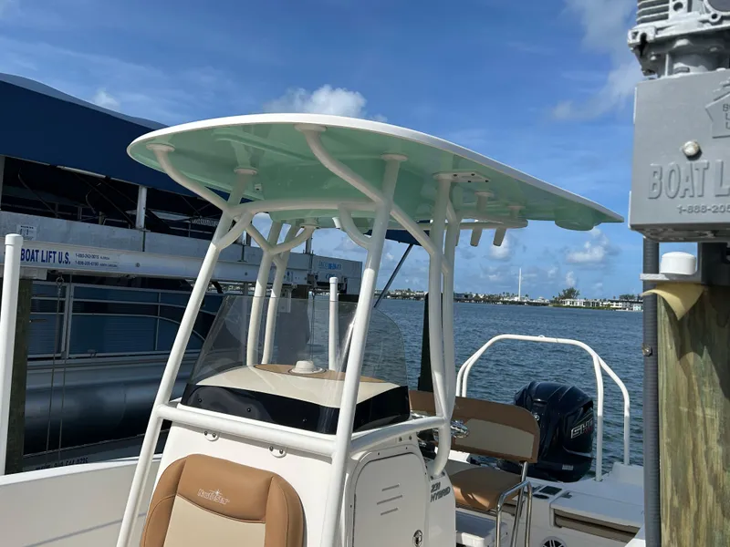 Slide: The Image of 2023 NauticStar 231 Hybrid boat interior with steering console and seating. - 7