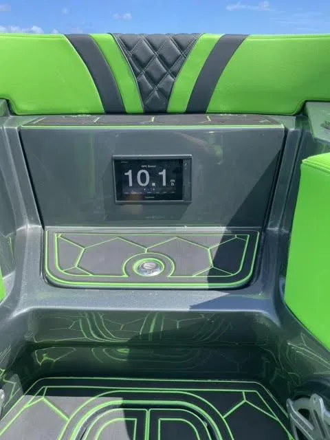 Slide: The Image of 2020 Midnight Express Open 43 boat interior with green accents and digital display. - 10