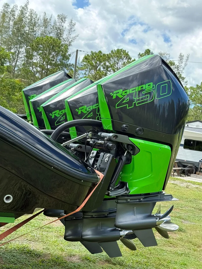 Slide: The Image of Triple Racing 450 outboard engines on a 2020 Midnight Express Open 43 boat. - 13