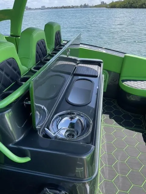 Slide: The Image of 2020 Midnight Express Open 43 boat interior with green accents and sleek design. - 9