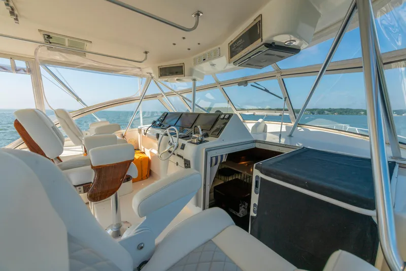 Slide: The Image of Interior of 1999 Ocean Yachts 48 Express, featuring helm and seating with ocean view. - 29