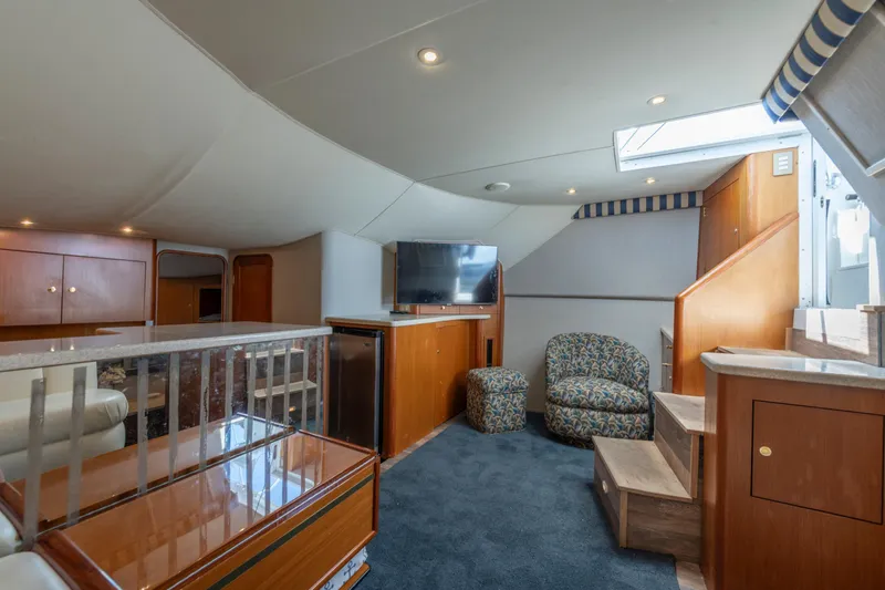 Slide: The Image of Luxurious interior of 1999 Ocean Yachts 48 Express with modern furnishings and natural light. - 37