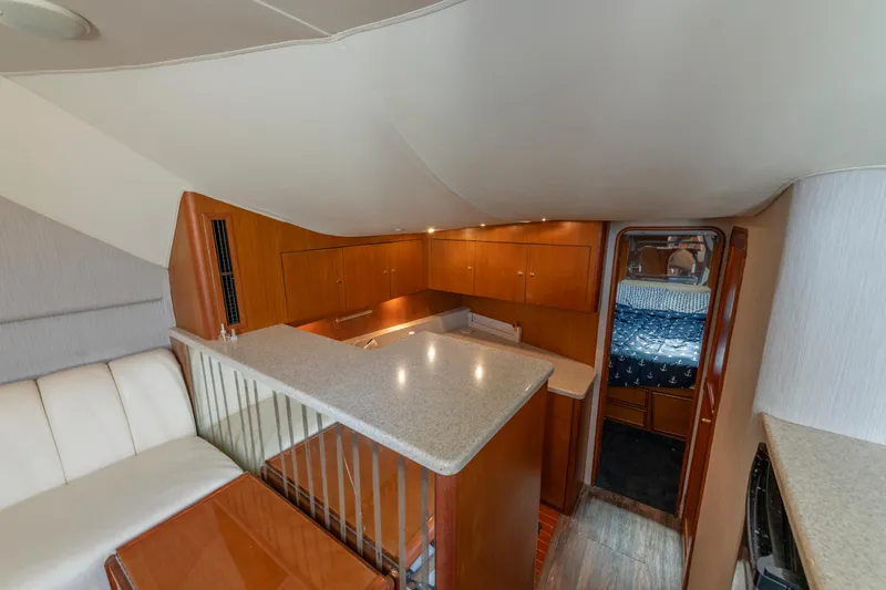 Slide: The Image of 1999 Ocean Yachts 48 Express interior with modern kitchen and cozy cabin. - 41