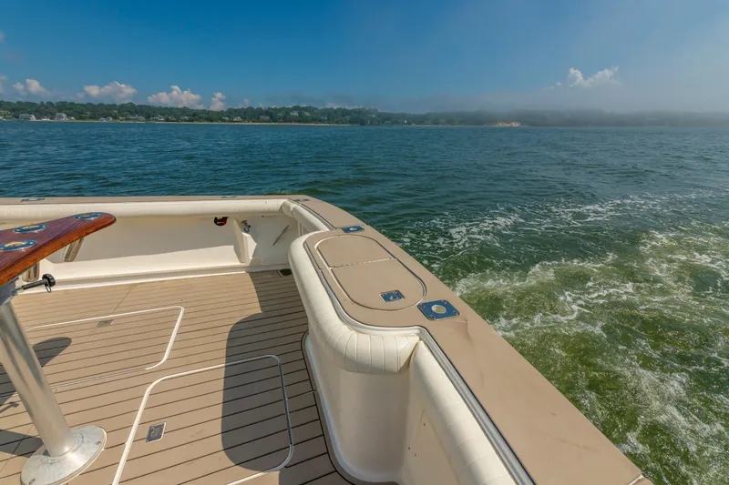 Slide: The Image of 1999 Ocean Yachts 48 Express boat deck with scenic ocean view. - 16