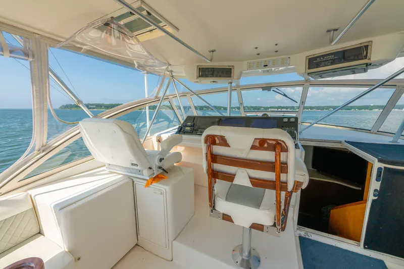 Slide: The Image of 1999 Ocean Yachts 48 Express helm with panoramic ocean view and comfortable seating. - 31