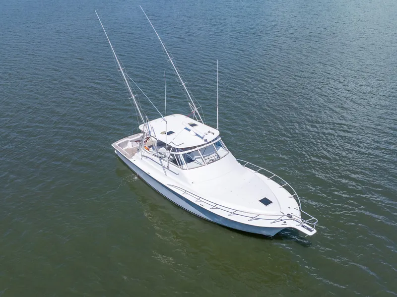 Slide: The Image of 1999 Ocean Yachts 48 Express boat on calm water, aerial view. - 6