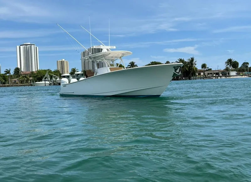 Slide: The Image of 2022 Valhalla Boatworks V-37 on water, cityscape background, clear sky. - 3