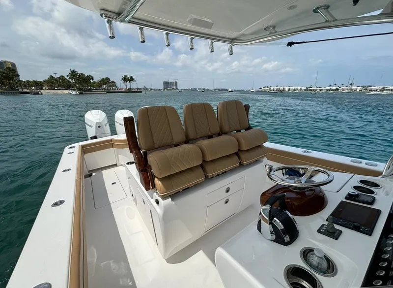 Slide: The Image of 2022 Valhalla Boatworks V-37 cockpit with helm, seating, and ocean view. - 6