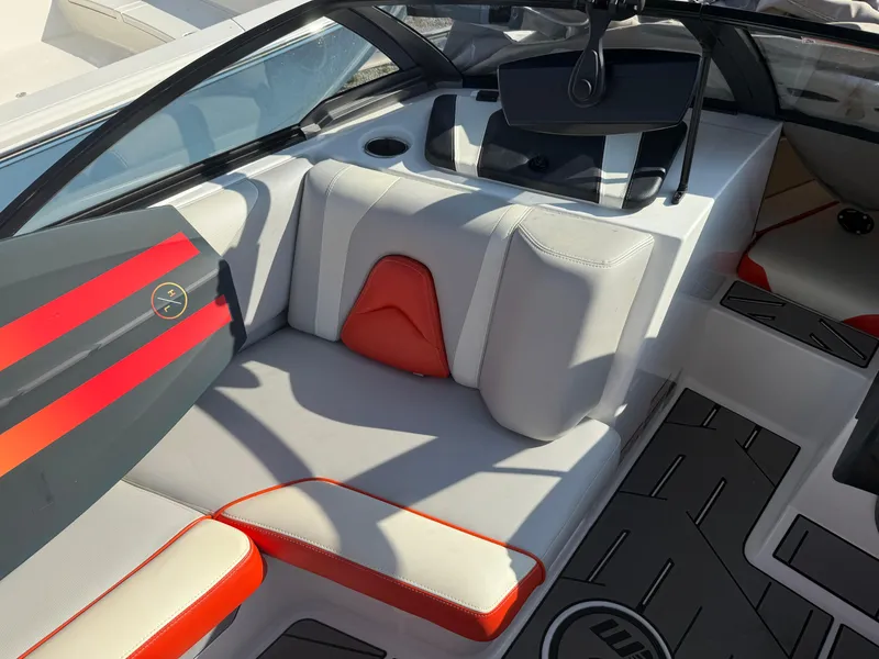 Slide: The Image of 2017 Malibu Wakesetter 21 VLX interior with gray and red seating, cup holder, and sleek design. - 6
