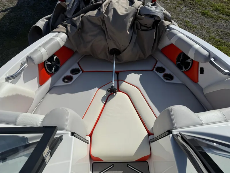 Slide: The Image of 2017 Malibu Wakesetter 21 VLX boat interior with red accents and seating. - 8