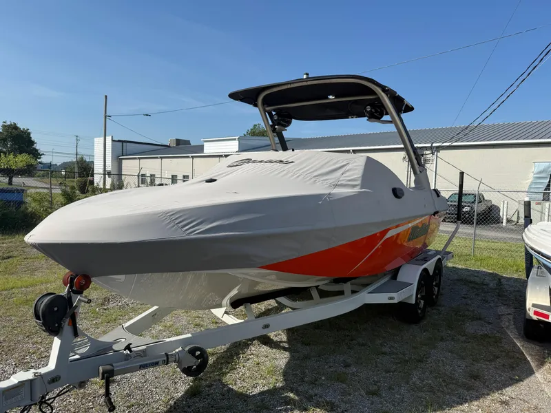 Slide: The Image of 2017 Malibu Wakesetter 21 VLX boat on trailer, covered, outdoors. - 9