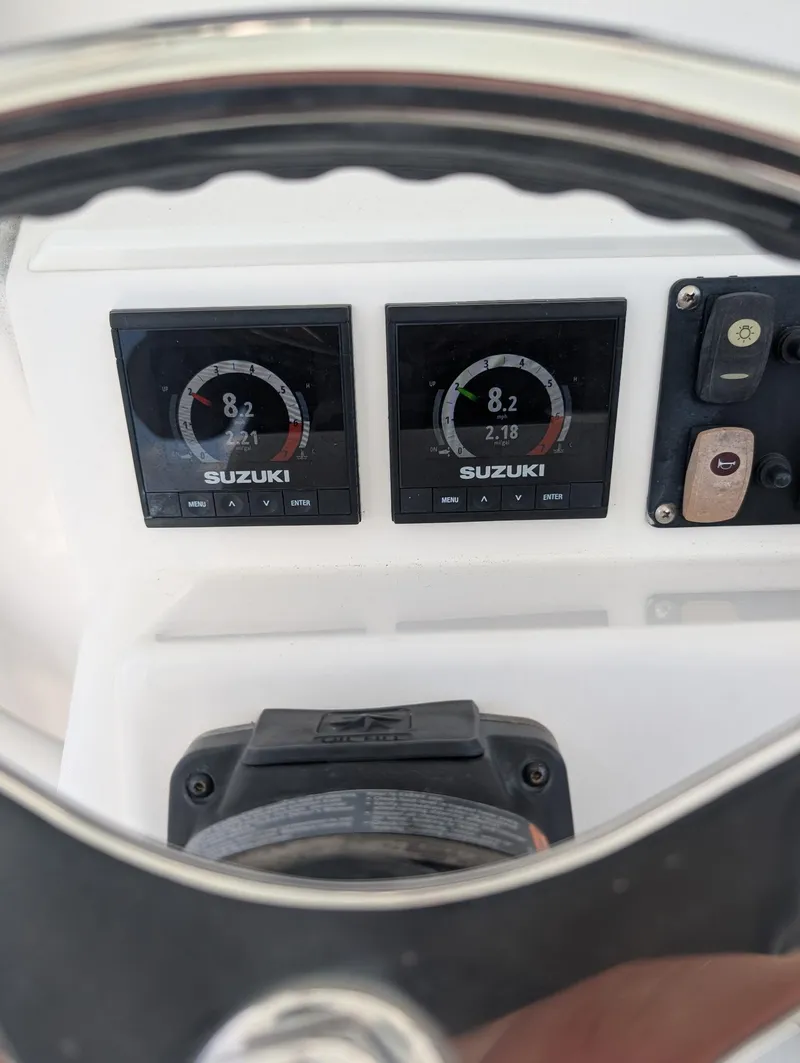Slide: The Image of Dashboard of a 2016 Southport 272TE boat with Suzuki engine displays. - 4