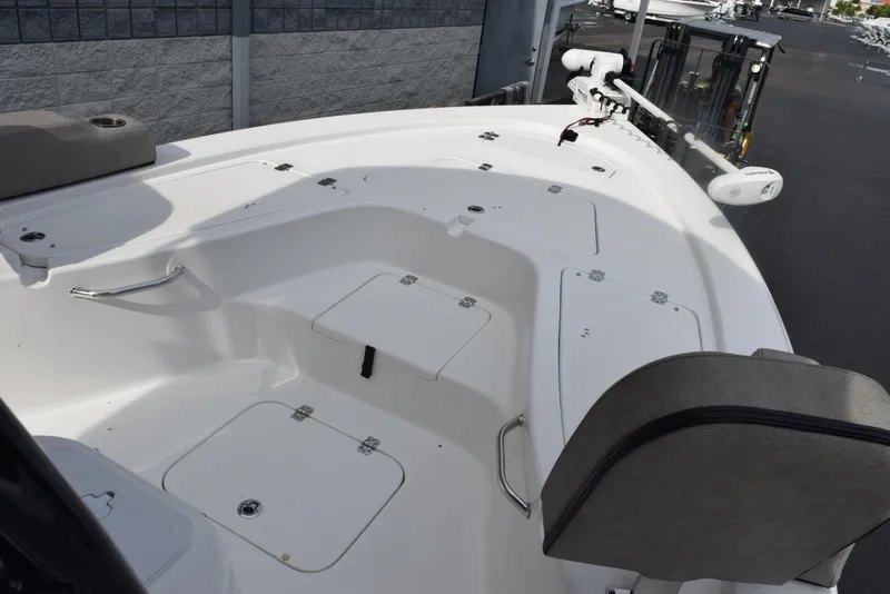 Slide: The Image of 2022 Sea Pro 228 Bay boat deck with storage compartments and seating. - 13