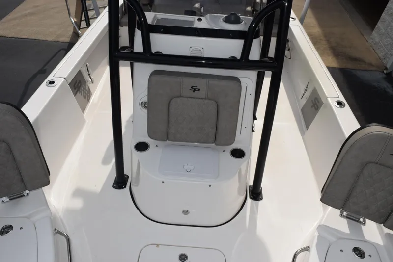 Slide: The Image of 2022 Sea Pro 228 Bay boat interior with seating and storage compartments. - 15