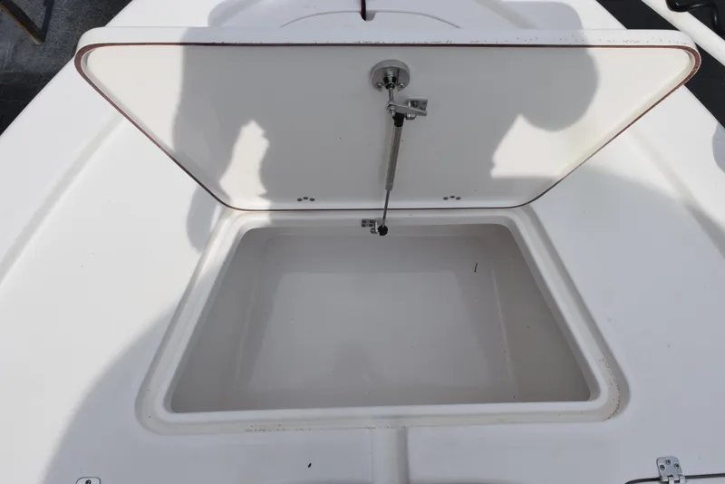 Slide: The Image of Open storage compartment on a 2022 Sea Pro 228 Bay boat. - 17