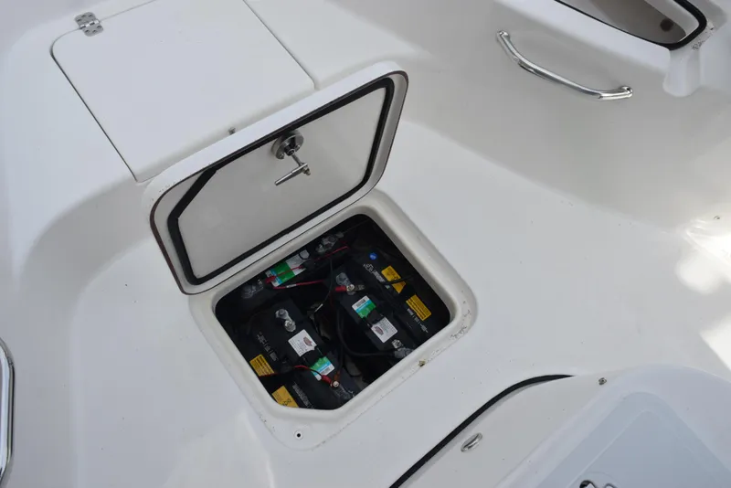 Slide: The Image of Battery compartment of 2022 Sea Pro 228 Bay boat, open hatch view. - 21