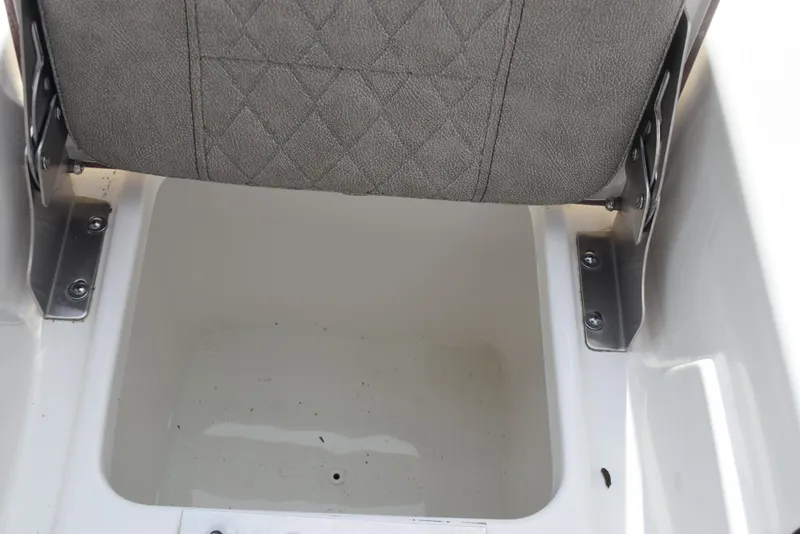 Slide: The Image of 2022 Sea Pro 228 Bay boat storage compartment with cushioned seat. - 27