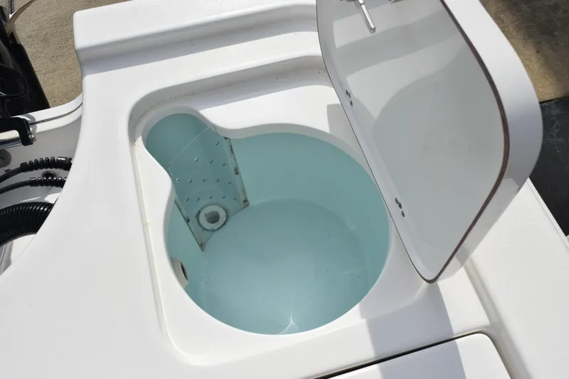 Slide: The Image of Open livewell on 2022 Sea Pro 228 Bay boat, showcasing interior design. - 30