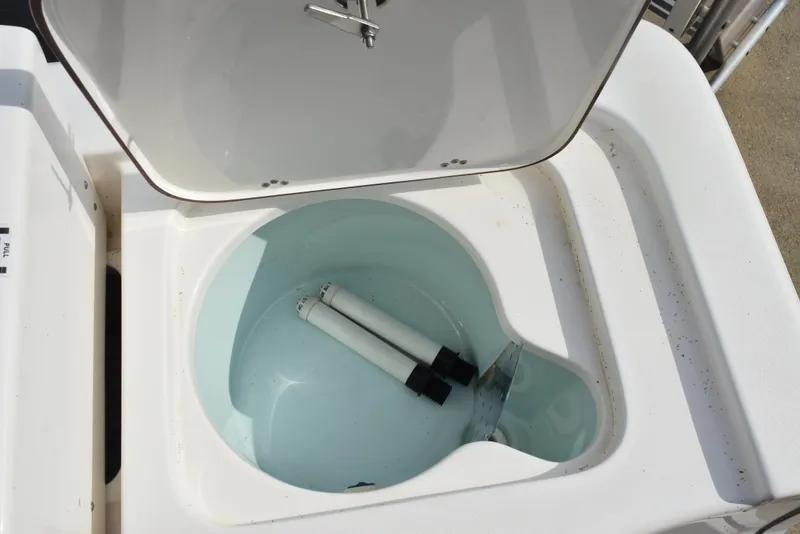 Slide: The Image of Open storage compartment on 2022 Sea Pro 228 Bay boat, showing interior details. - 31
