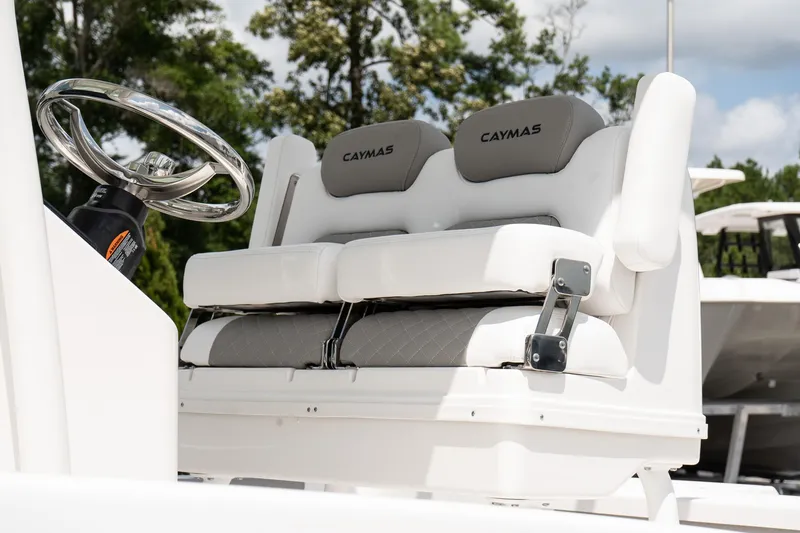 Slide: The Image of 2026 Caymas 24 HB boat seats and steering wheel, featuring modern design and comfort. - 8
