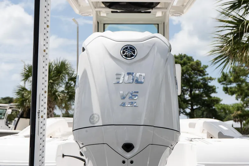 Slide: The Image of Yamaha 300 V6 4.2L engine on 2026 Caymas 24 HB boat, outdoors. - 9