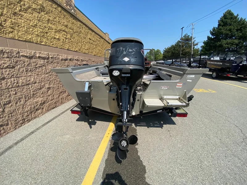 Slide: The Image of 2005 Tracker Targa 18 WT boat, rear view, parked outdoors on a sunny day. - 2