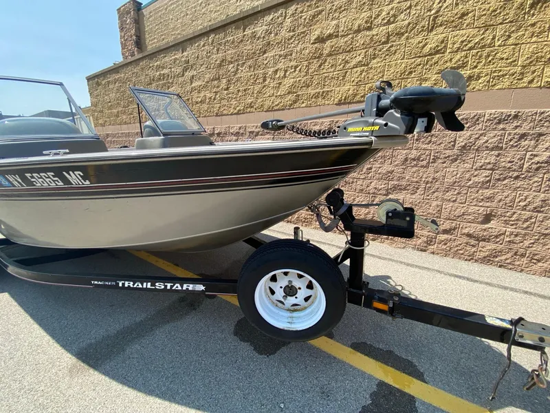 Slide: The Image of 2005 Tracker Targa 18 WT boat on a Trailstar trailer, parked outdoors. - 3