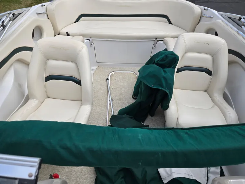 Slide: The Image of Interior view of a 1998 Chris-Craft 210 Bowrider boat with cushioned seating. - 20