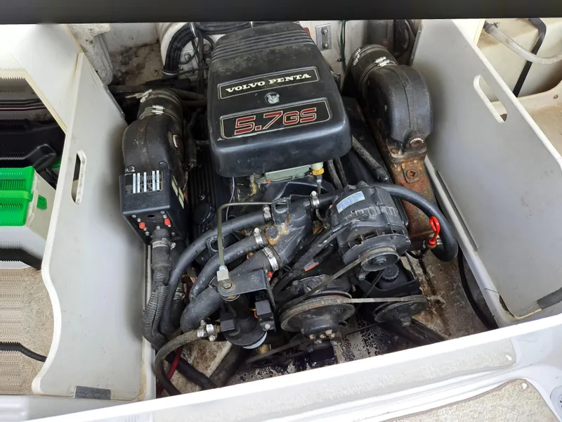 Slide: The Image of 1998 Chris-Craft 210 Bowrider interior with white seating and carpeted floor. - 22