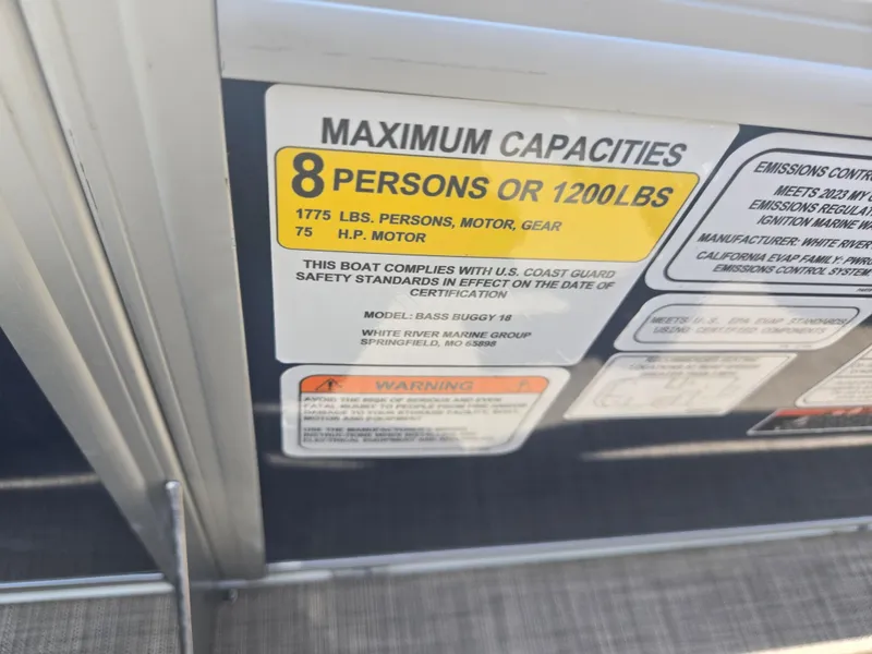 Slide: The Image of 2023 Sun Tracker Bass Buggy 18 DLX capacity label, 8 persons or 1200 lbs, 75 HP motor. - 13