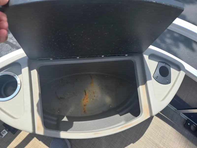 Slide: The Image of Open storage compartment on 2023 Sun Tracker Bass Buggy 18 DLX boat. - 23