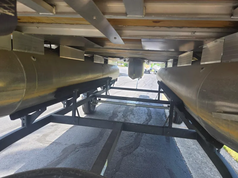 Slide: The Image of Underneath view of 2023 Sun Tracker Bass Buggy 18 DLX pontoon boat on trailer. - 7