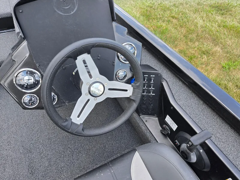 Slide: The Image of 2022 Vexus AVX181 boat dashboard with steering wheel and control panel. - 13